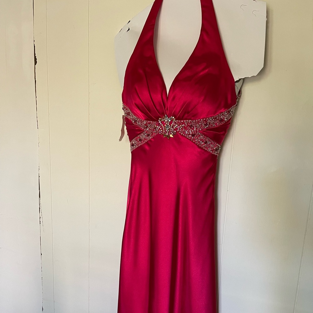 Prom floor length red beaded dress.